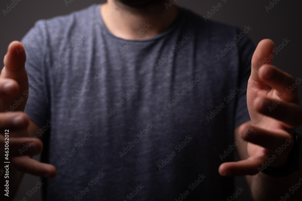 Poster man showing his empty hand.