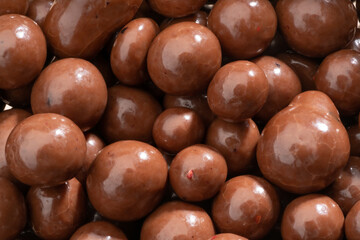 Detailed and large close up shot of chocolate covered blueberries.