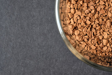 Close up of Freeze Dried Instant Coffee in Glass Coffee Cup, Food Background, Copy Space for Text.
