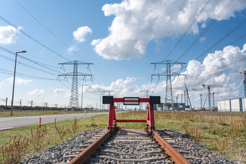 wooden buffer stop with red stop sign ending rail tracks concept for limit. Buffer stop . The final...