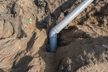 Plastic pipes in the ground during the construction of a building