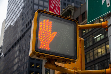 Don't walk New York traffic sign with illuminated and blurred background