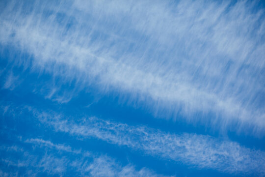 blue sky pattern with lined clouds