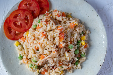 Fried rice with mixed vegetables and pork, top view