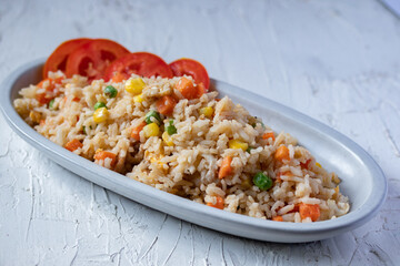 Fried rice with mixed vegetables and pork, top view