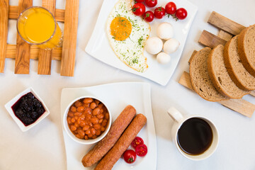 breakfast with coffee, orange juice and sausage