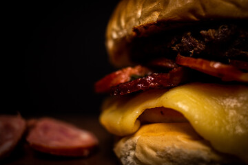 Handmade snack with black background and shiny wood table