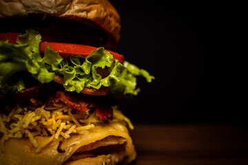 Handmade snack with black background and shiny wood table