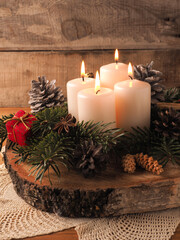 Fourth Advent candle burning, traditional Christmas decoration - obrazy, fototapety, plakaty