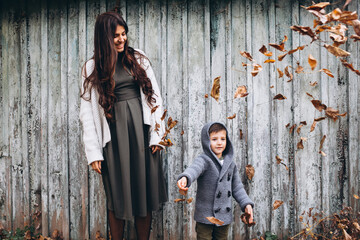 Mother with little son in an autumn park