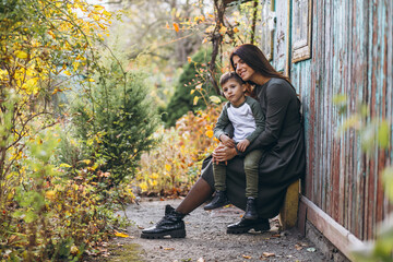 Mother with little son in an autumn park