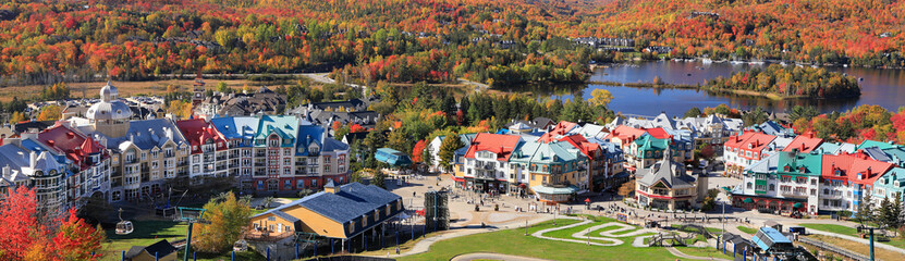 Panoramic aerial view of Mont Tremblant resort and lake with autumn color leaf, Quebec, Canada
