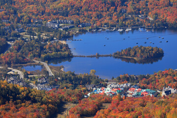 Aerial close-up view of Mont Tremblant resort and lake with autumn color leaf, Quebec, Canada