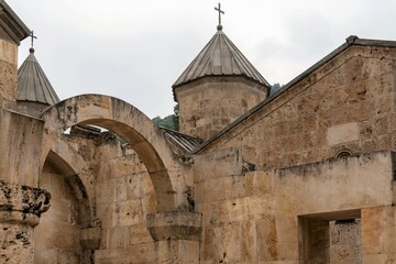 Fototapeta na wymiar Armenia, Haghartsin, September 2021. The walls of the monastery and the dome of the church.