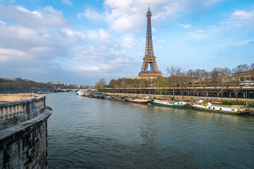 A view from Pont de Bir-Hakeim on the riverside in Paris on a sunny spring day