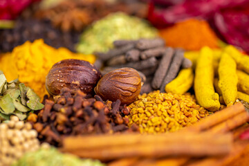 Various spices, peppers and herbs close-up top view. Eastern spice market. A set of peppers and spices for cooking.