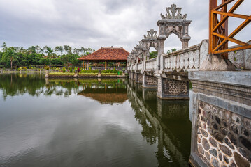 A bridge to pavilion in Ujung Water Palace on Bali island, Indonesia