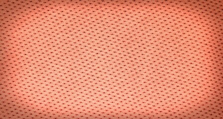 Abstract coral color fabric texture background. Peach color textile detail with vignetting effect.  Blank light horizontal image with copy space.  