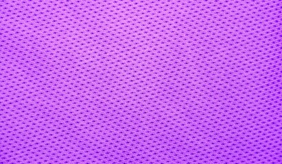 Purple background, textured violet fabric close-up, space for text.