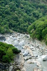 Fototapeta na wymiar Steep rocks along river at Taroko National Park, Taiwan