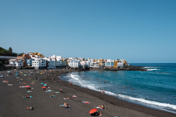People at beach in Puerto de la Cruz, Tenerife,
