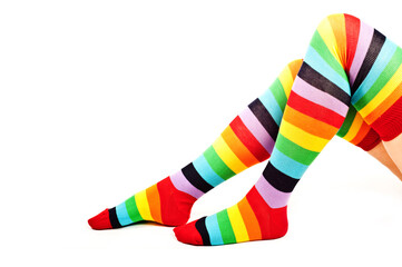 legs of a woman with colorful raibow high socks