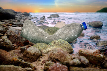 Water bottles on the rocky beach	