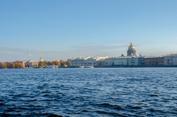 Fototapeta na wymiar Autumn Petersburg. View of the Neva River and the sights of St. Petersburg from the Lieutenant Schmidt Bridge, Russia
