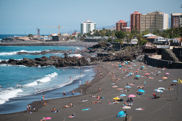 People at beach in Puerto de la Cruz, Tenerife,