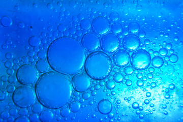 Naklejka na ściany i meble Water drops mixed with detergent on a color background