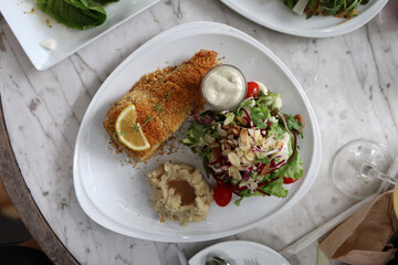 Grilled sea brass with crispy powder serving with fresh salad and mash potato