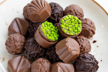 assortment of luxury chocolates on a white background. Close up