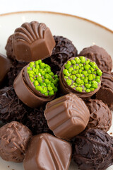 assortment of luxury chocolates on a white background. Close up