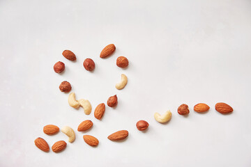 Vegan healthy snacks: almonds in shape of heart. Copy space