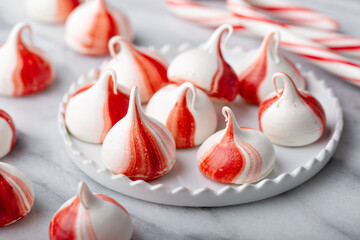 Peppermint meringues on a marble table, Christmas treat