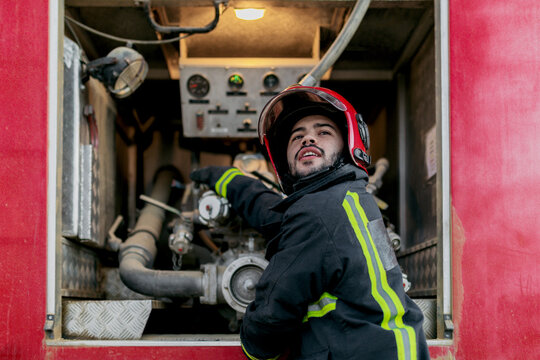 Firefighter working with equipment