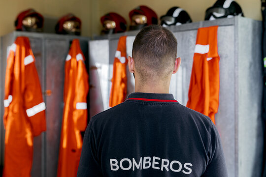 Firefighter on his back in the locker room