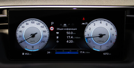 Modern digital car dashboard. Close up of illuminated car digital dashboard.