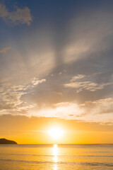 Landscape empty beach island during Sunset.Red purple orange blue pink sunsets over sea and Burning sky and shining golden waves.Sun over sea silhouette paradise island.