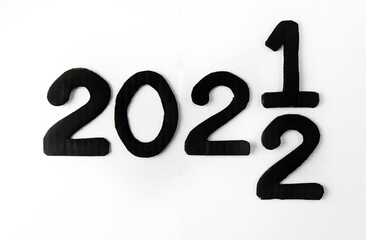 The number from 2021 to 2022 on the asphalt road surface with arrow marking lines, the concept of a happy new year