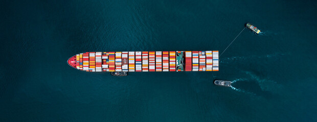Tug ship drag container cargo ship vessel to cargo international container yard port concept...