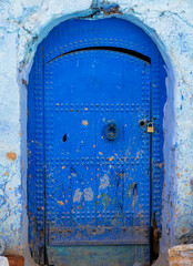 Chefchaouen, Morocco - 6 October, 2021: Blue street and houses in Chefchaouen, Morocco. Beautiful colored medieval street painted in soft blue color.