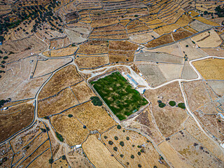 Aerial view on a green football field during drought on sifnos island, Greece © Eric Isselée
