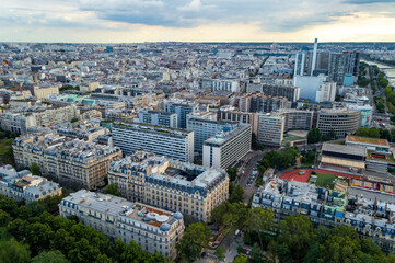 Obraz premium Aerial city landscape of Paris, lots of roofs characteristic roofs and chimney 