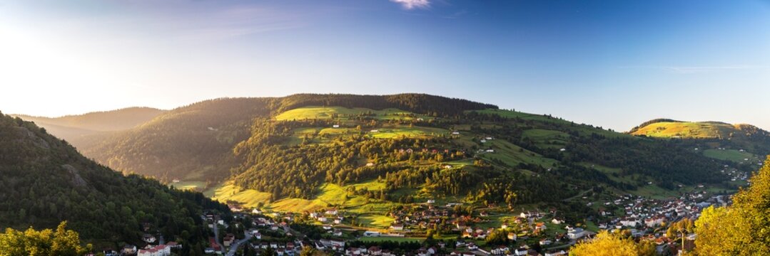 Sun rise over landscape with mountains and view of La Bresse, France