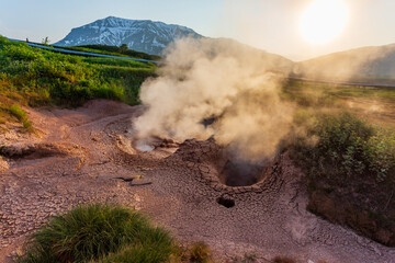 Steaming, sulfuric, active fumaroles near Pauzhetskaya Geothermal Power Plant, Kamchatka Peninsula,...