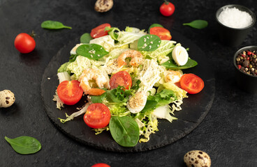 Fresh seafood salad. Grilled shrimp, fresh vegetable salad and egg. Fried shrimps. Healthy food on stone background