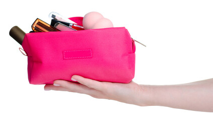 Pink cosmetic bag with many make up cosmetics beauty in hand on white background isolation