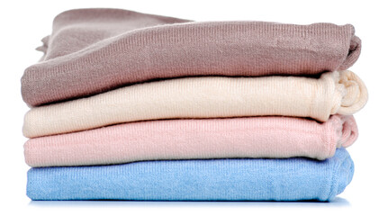 Fototapeta na wymiar Stack folded sweaters on white background isolation