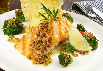 Grilled Salmon Steak with Broccoli, mashed Potatoes Cheese Cracker on wooden Background
